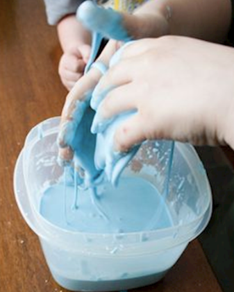 hands dipped in oobleck